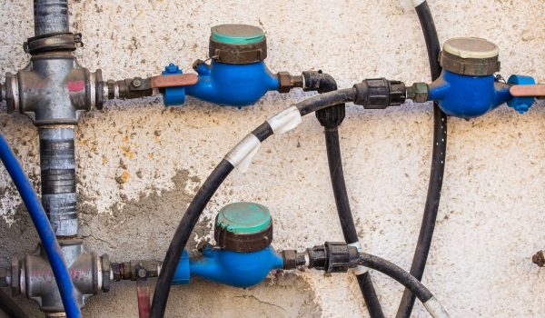 Water meters, sanitary equipment on dark background.